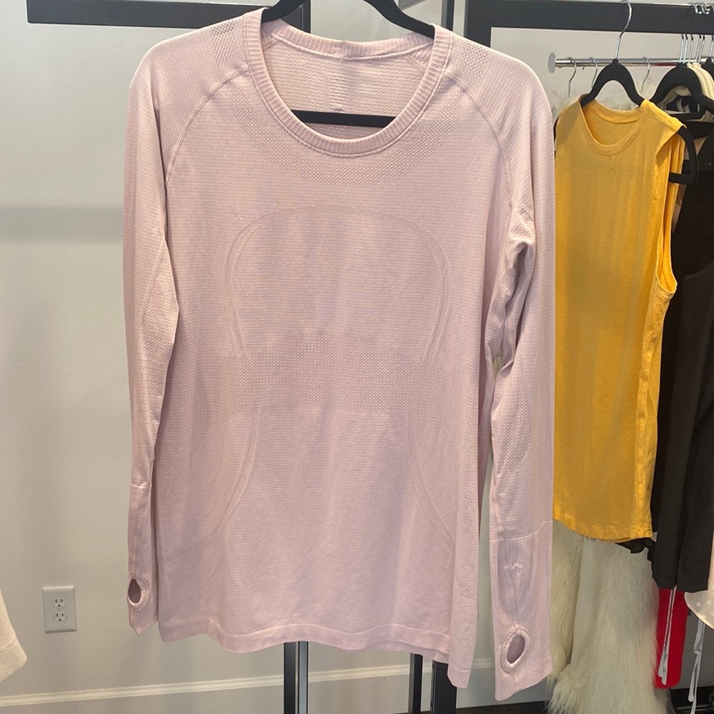 Lululemon size 10 long sleeve with thumb holes. No rips tears or stains